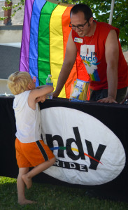 A young attendee gets information about Circle City IN Pride at the 2014 Spencer Pride Festival